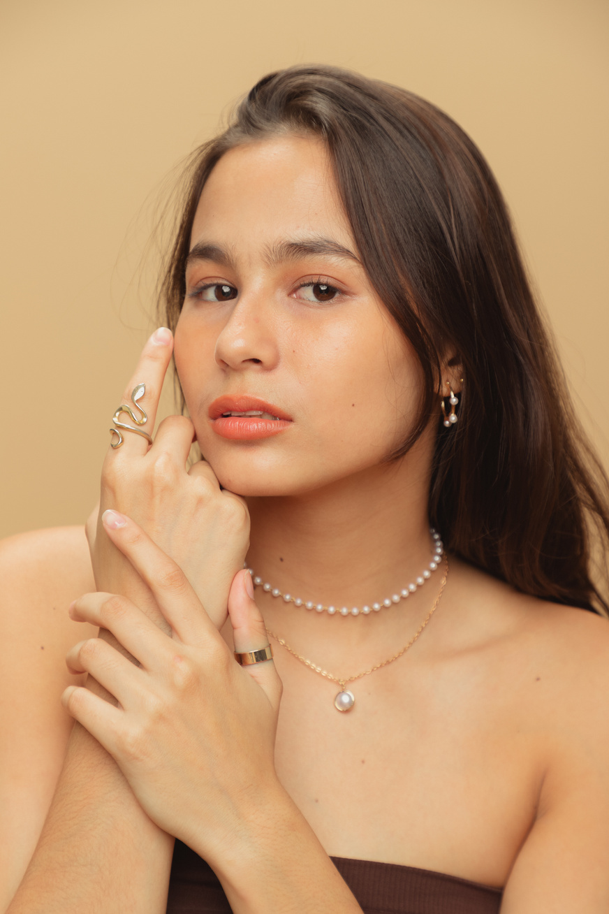 Woman with Pearl and Gold Jewelry